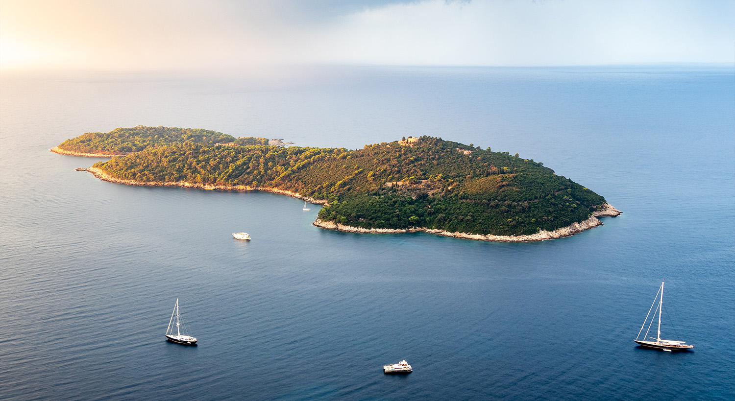 Sailing boats around a small island in Croatia