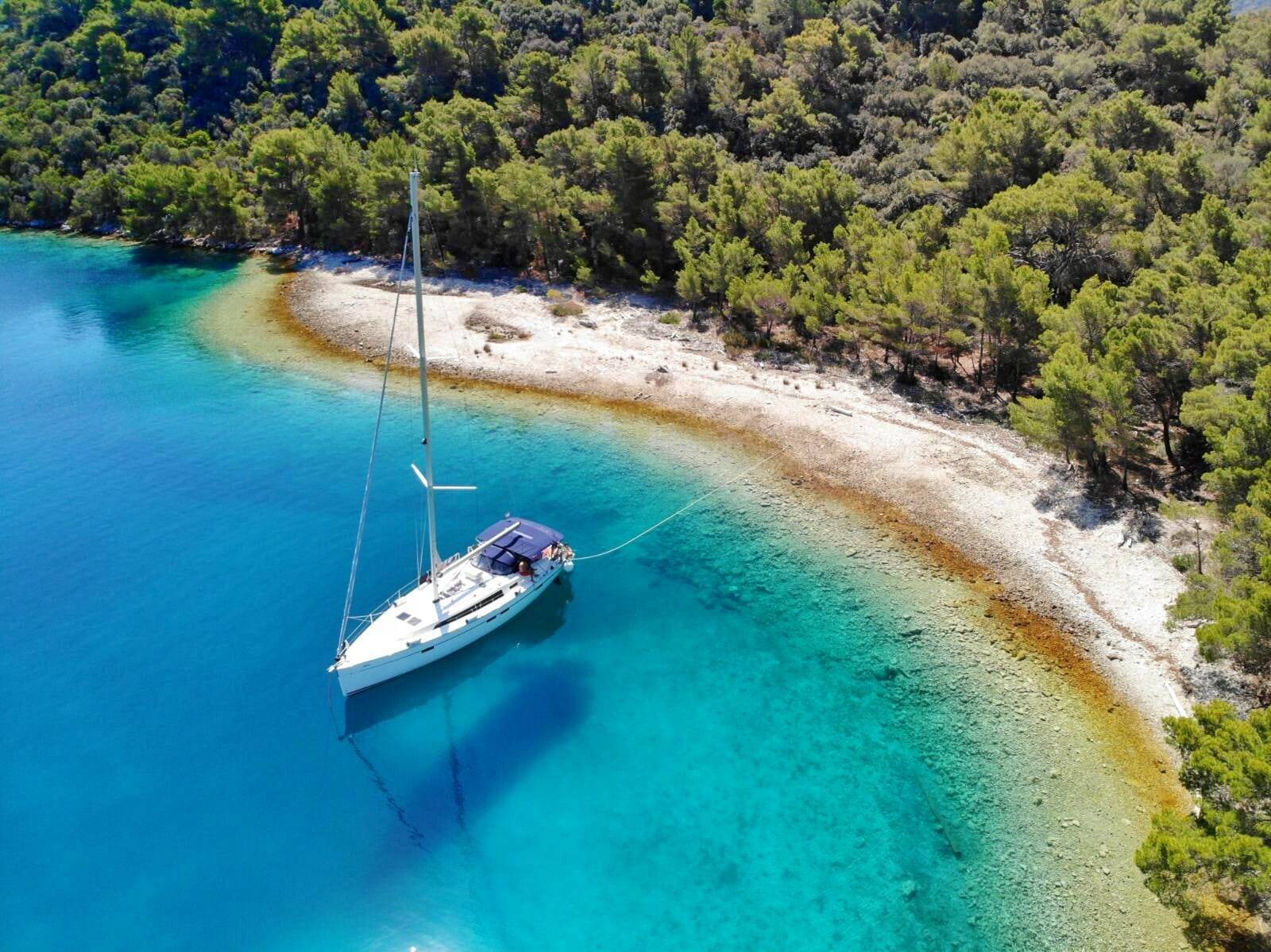 Anchored yacht in cove in Croatia