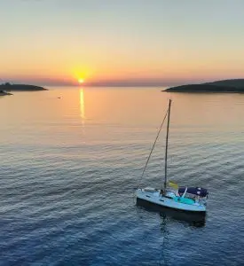 Sailboat cruising in Croatia in sunset
